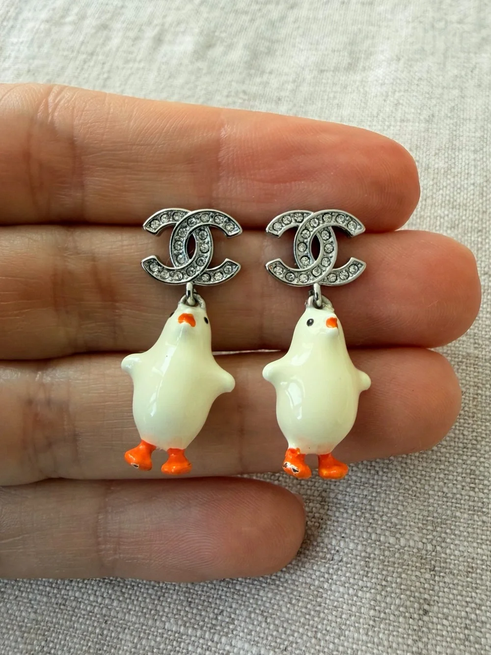 CHANEL White Enamel Chicken CC Drop Earrings with Orange Accents